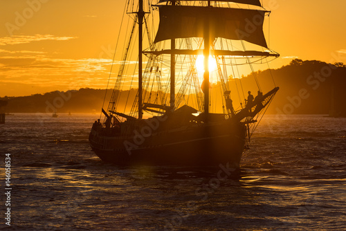 Sailing ship on colorful sunset