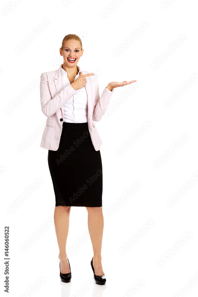 Business woman presenting something on open palm Business woman presenting something on open palm