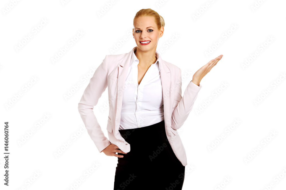Business woman pointing for copyspace or something Business woman pointing for copyspace or something
