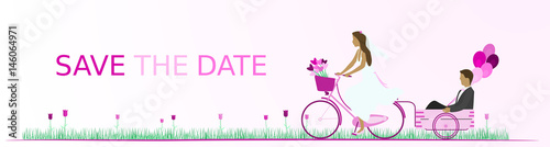 Save the date - wedding. Bridal couple with bicycle in a field full of heart flowers and with balloons. Pink shade.