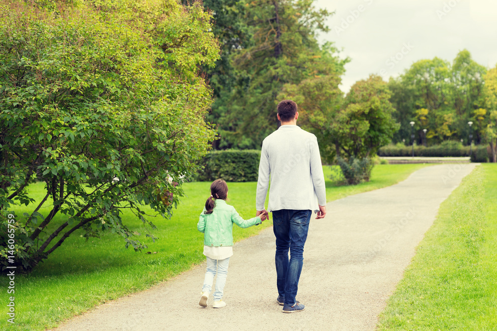 happy family walking in summer park