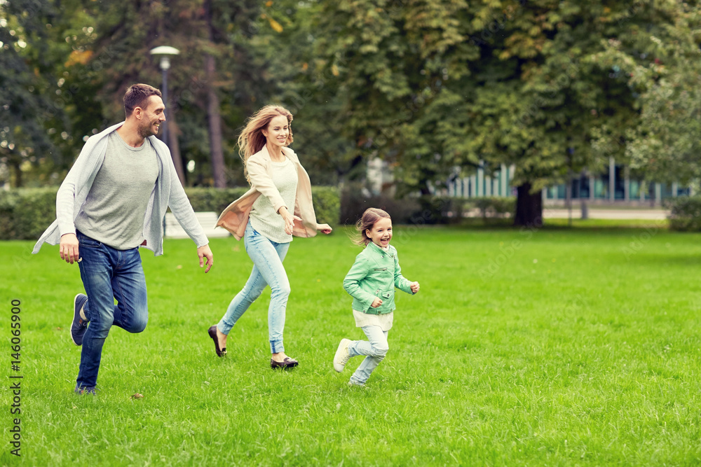 happy family walking in summer park happy family walking in summer park