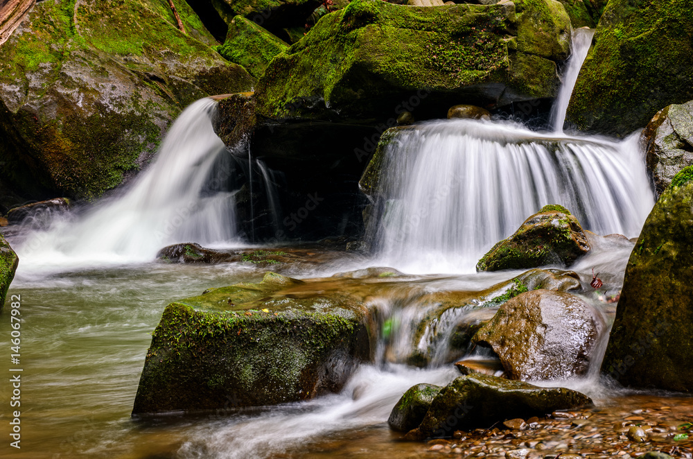 small cascade on the river among bouders small cascade on the river among bouders