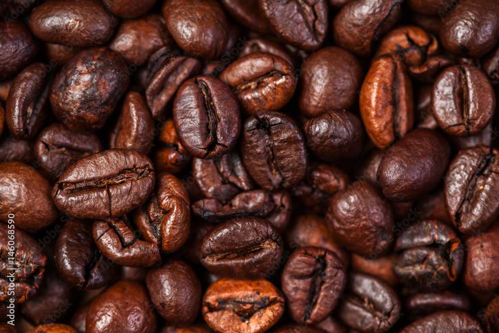 Coffee beans macro on a brown background