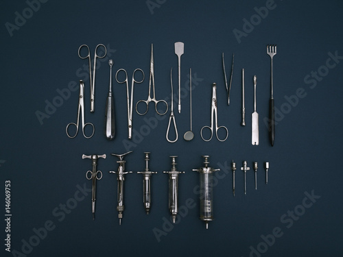 Directly above shot of various medical tools on blue background