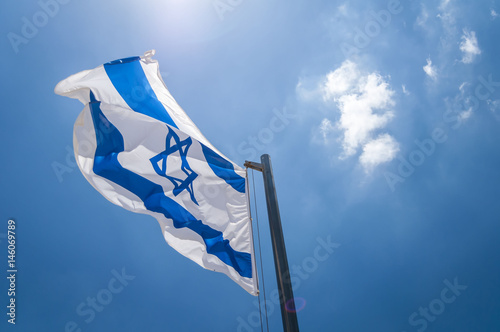 The flag of Israel in the blue sky stock image. Israeli flag, Yom Haatzmaut, Israel Independence Day, Zionsim. Herzl Mount, Jerusalem, Israel. June 2016.