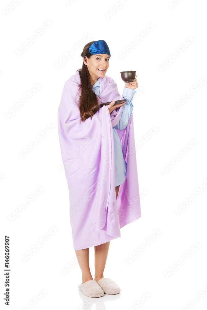 Morning woman wrapped in coverlet.