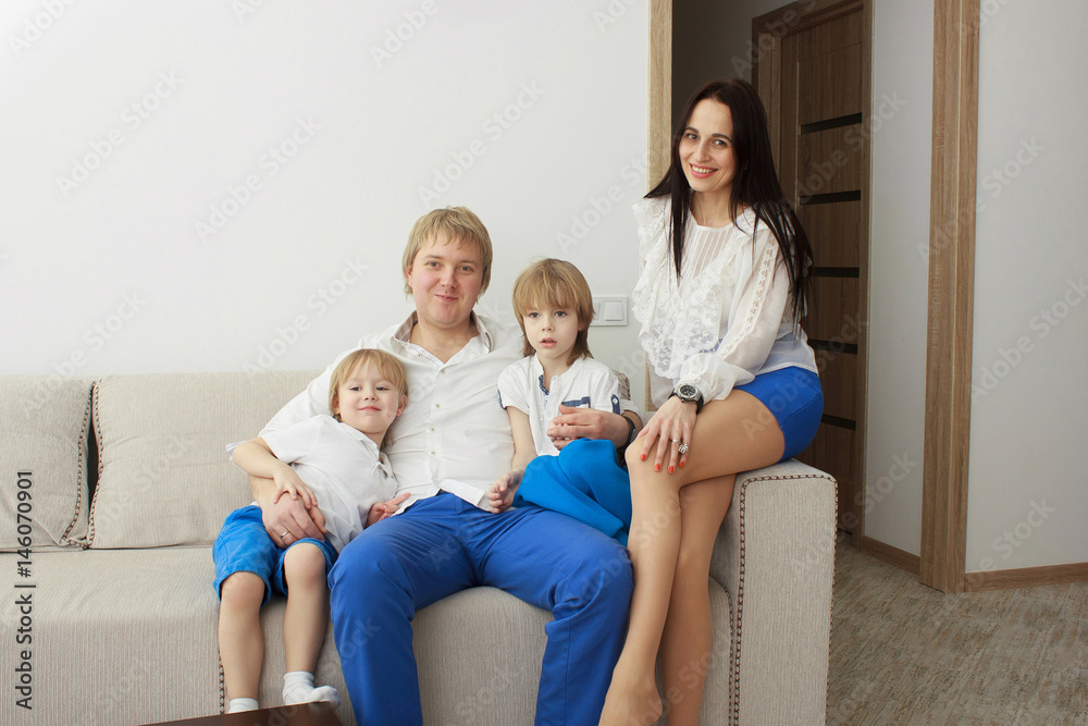 Family relaxing on sofa