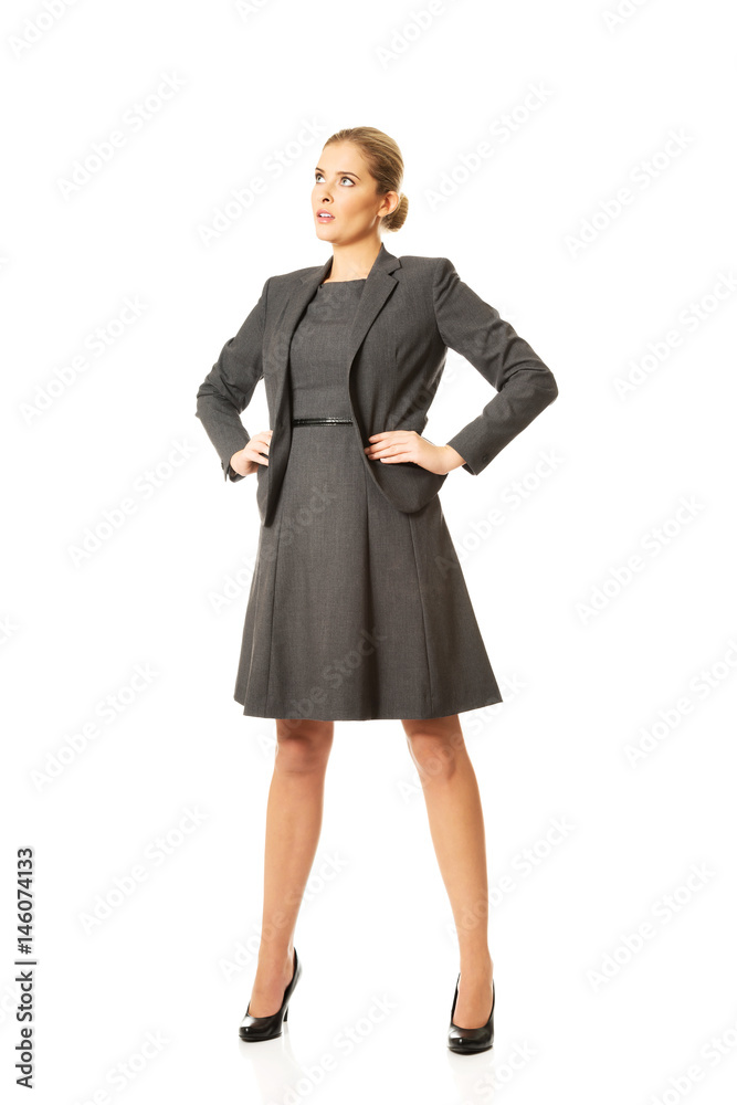 Businesswoman standing with hands on hips Businesswoman standing with hands on hips