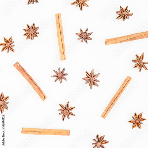 Natural pattern of cinnamon and anise tree on white background. Spice. Flat lay. Top view.