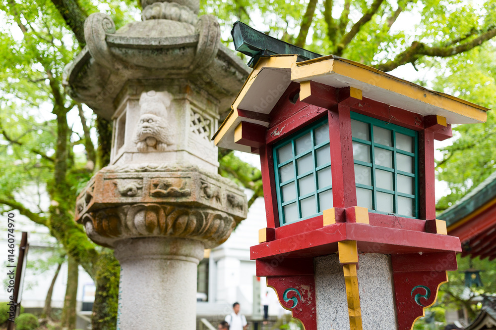 Japanese stone and wooden lantern in temple Japanese stone and wooden lantern in temple