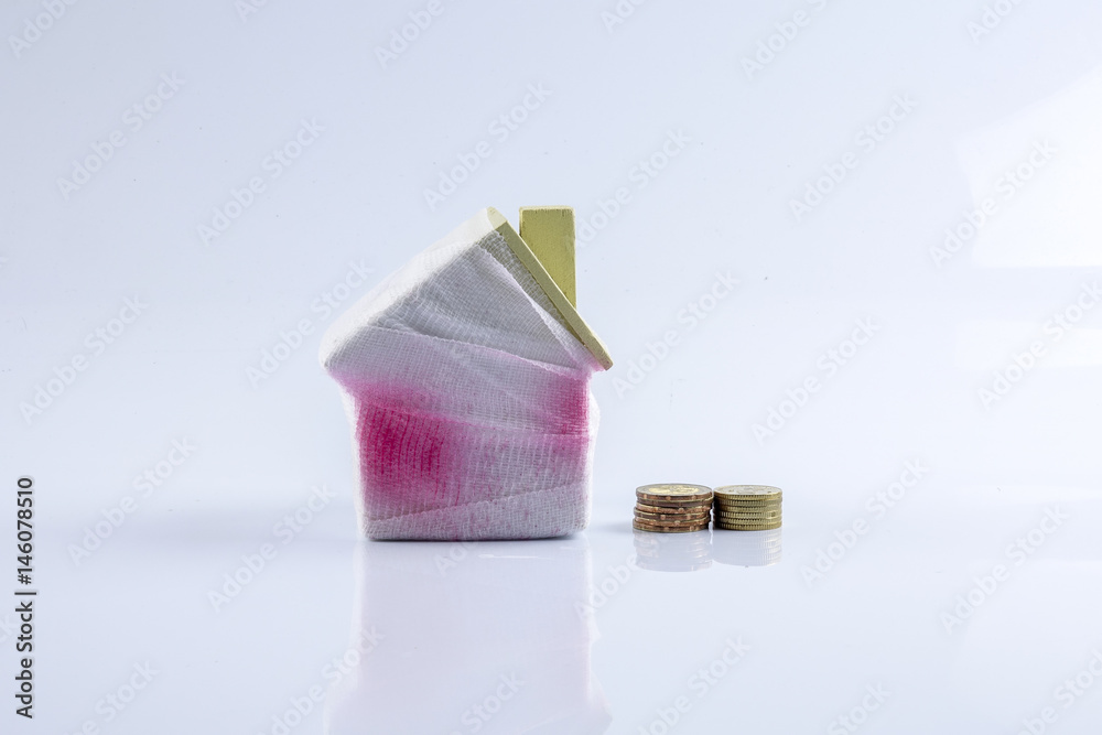 House and little coins. Deficency saving concept House and little coins. Deficency saving concept