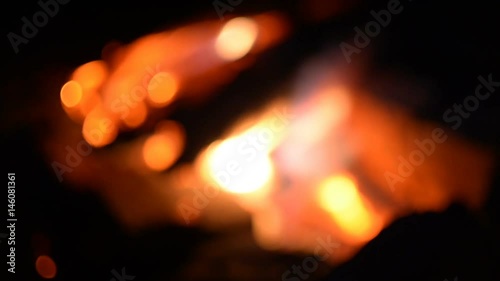 Blurred flame in a fire outdoors at night with a beautiful bokeh photo