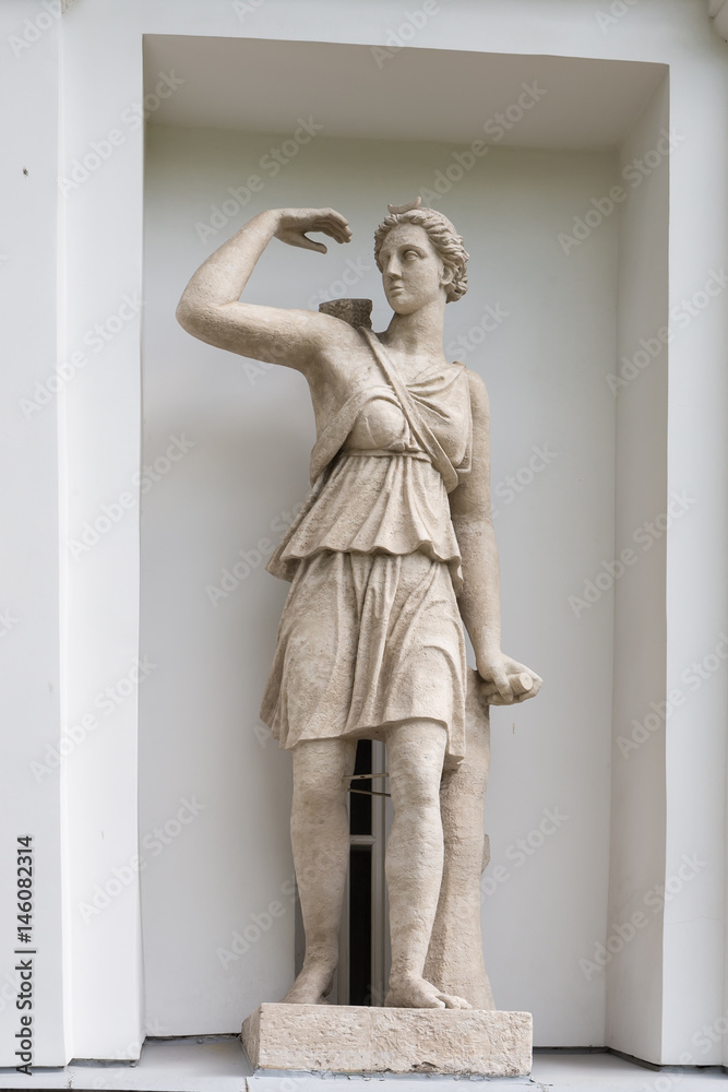Fototapeta premium The Goddess Artemis. Statue of Pudozh stone in the niche of the Kitchen Corps of the Elagin Island Palace and Park Complex in St. Petersburg