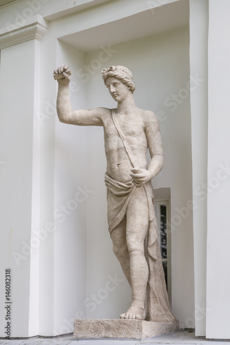 The God Apollo. Statue of Pudozh stone in the niche of the Kitchen Corps of the Elagin Island Palace and Park Complex in St. Petersburg