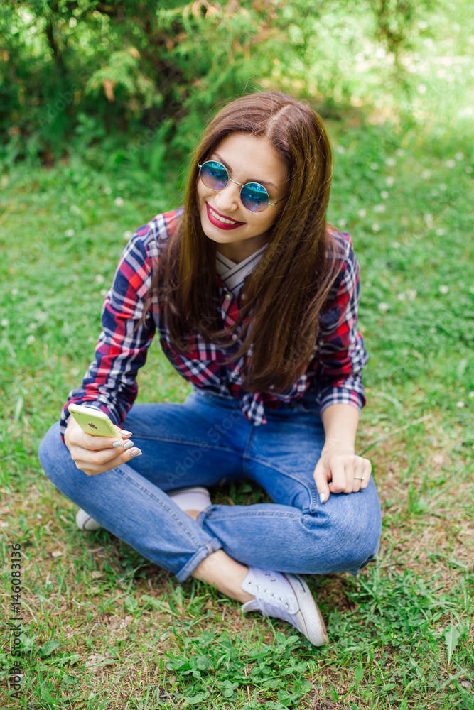 Fototapeta premium beautiful stylish women making selfie in park. Copy-space