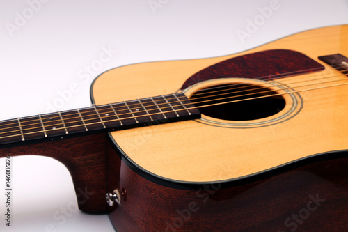 Acoustic guitar on a white background