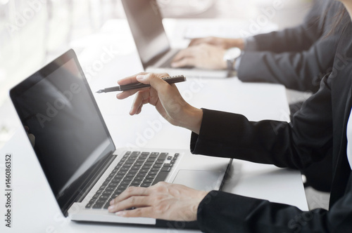 businesspeople working, using computer laptop, group discussing solution.