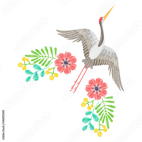 Embroidery with Asian crane, spring wildflowers for decor. Vector fashion embroidered ornament, pattern with flowers for textile, fabric traditional folk decoration.