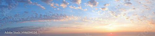 Sunset sky panorama with clouds