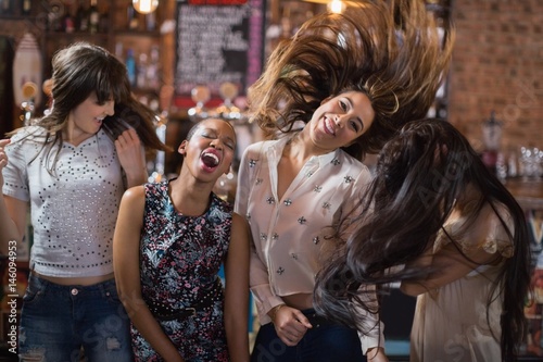 Cheerful female friends dancing