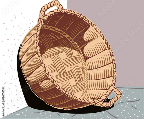 Wicker basket leaning against the wall.