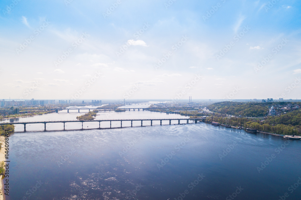 Panoramic view of the city of Kiev in the spring. View of the Dnieper River and bridges across it. Aerial view, from above. Outdoor.