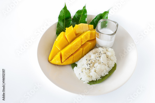 Fototapeta Naklejka Na Ścianę i Meble -  Thai style tropical dessert, Mango sticky rice and coconut milk.