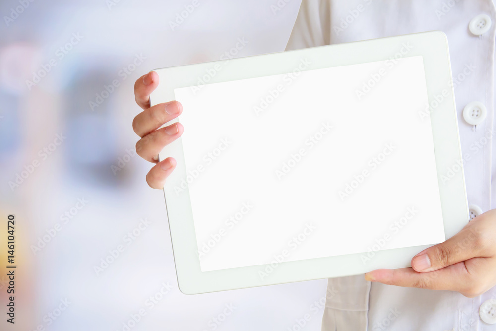 Doctor showing digital tablet with blank screen at the hospital Doctor showing digital tablet with blank screen at the hospital