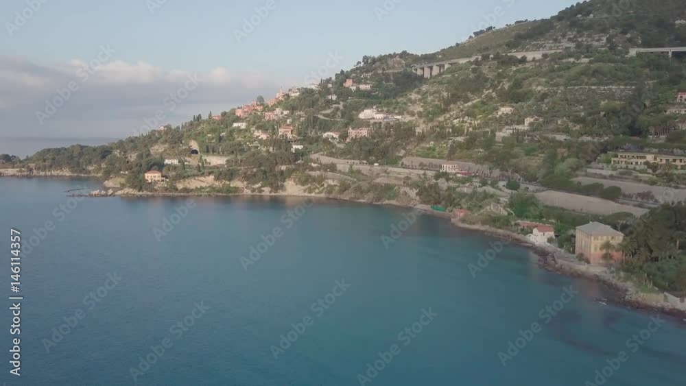 Flight over the mediterranean coastline on the border Italy France. Capo Mortola, Grimaldi (Ventimiglia), Italy, Europe. Aerial panoramic view 4K, UHD. Flight over the mediterranean coastline on the border Italy France. Capo Mortola, Grimaldi (Ventimiglia), Italy, Europe. Aerial panoramic view 4K, UHD.