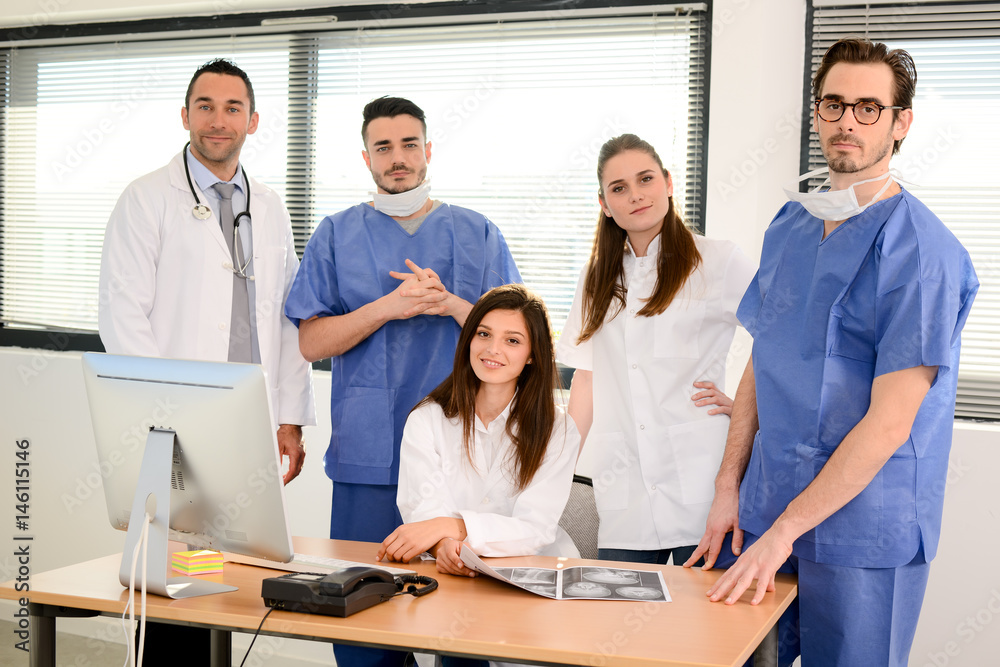 portrait of a medical team with nurse doctor and surgeon in hospital office wearing medical and operating room outfit