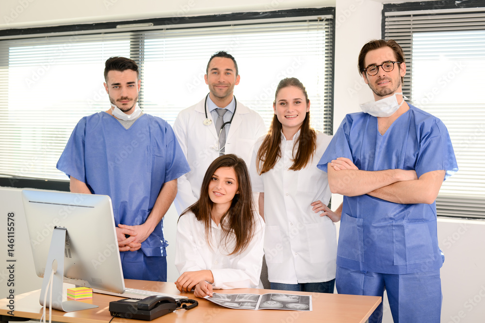 portrait of a medical team with nurse doctor and surgeon in hospital office wearing medical and operating room outfit