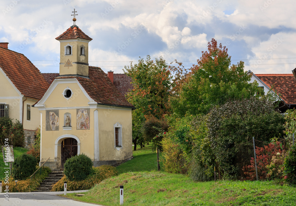 Naklejka premium Old church in Austrian village Perndorf. Municipality Puch bei Weiz, federal state Styria, Austria.