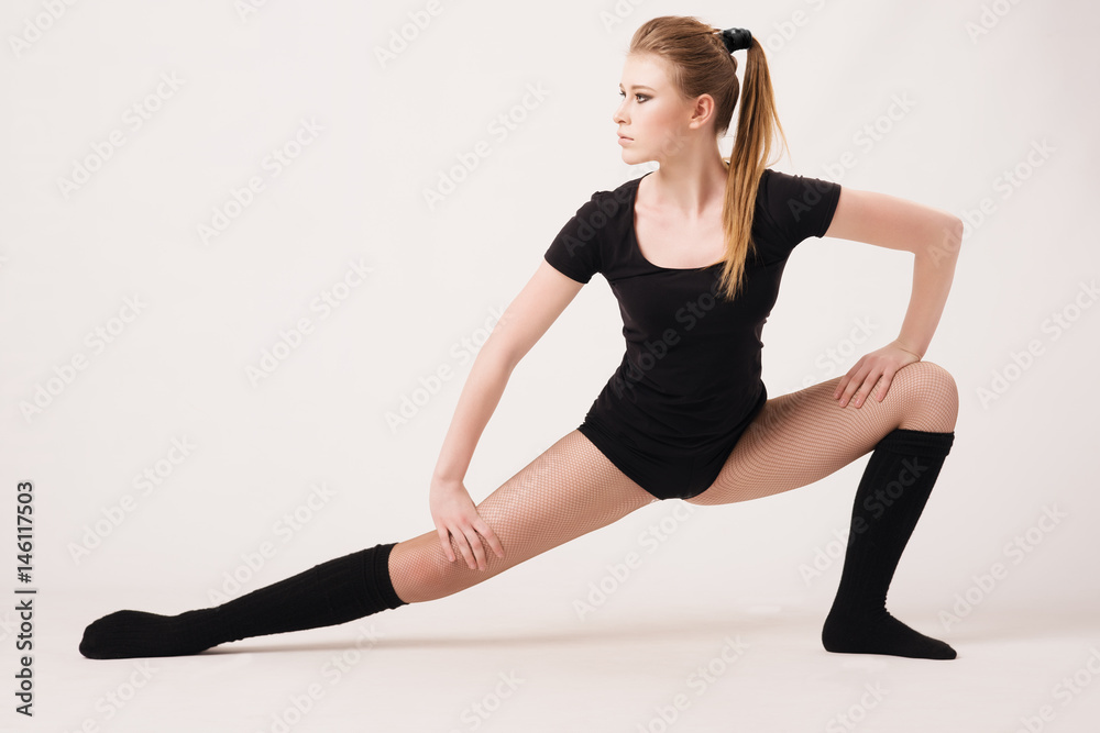 Plasticity. A girl performs an exercise on flexibility. Plasticity. A girl performs an exercise on flexibility.