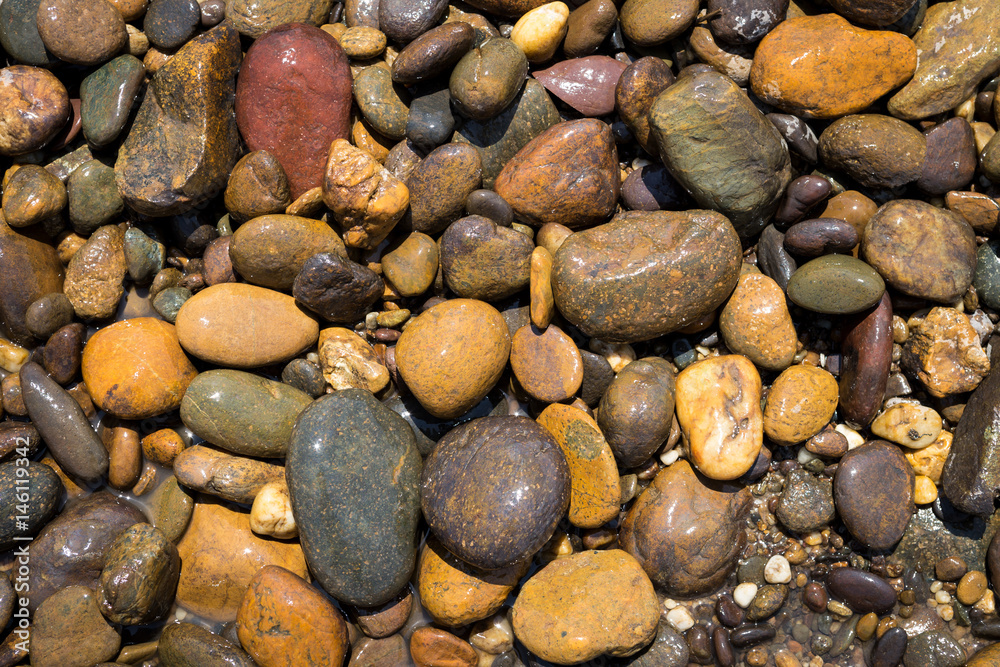 Closeup river rock background, outdoor day light Closeup river rock background, outdoor day light