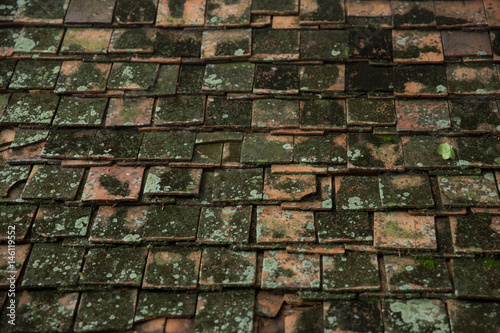 very old dirty roof tile of Thai Asian temple roof style architecture pattern background