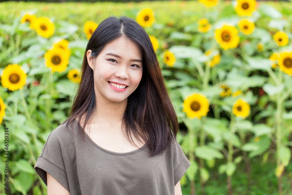 cute portrait asian Thai teen smile with sunflower with copy space. cute portrait asian Thai teen smile with sunflower with copy space.