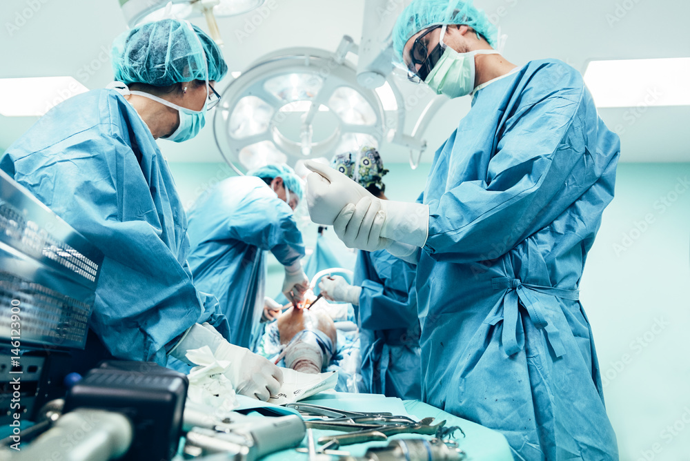 Team of Surgeons Operating.