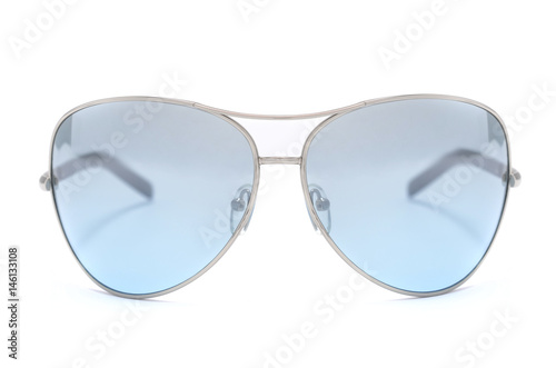 Sunglasses with blue glass in an iron frame isolated on white