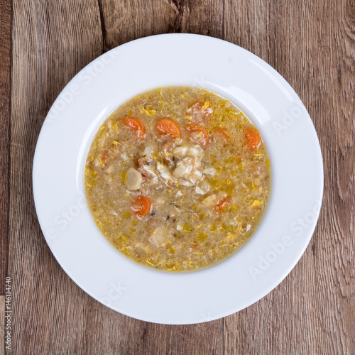 Vegetable soup on a wooden table