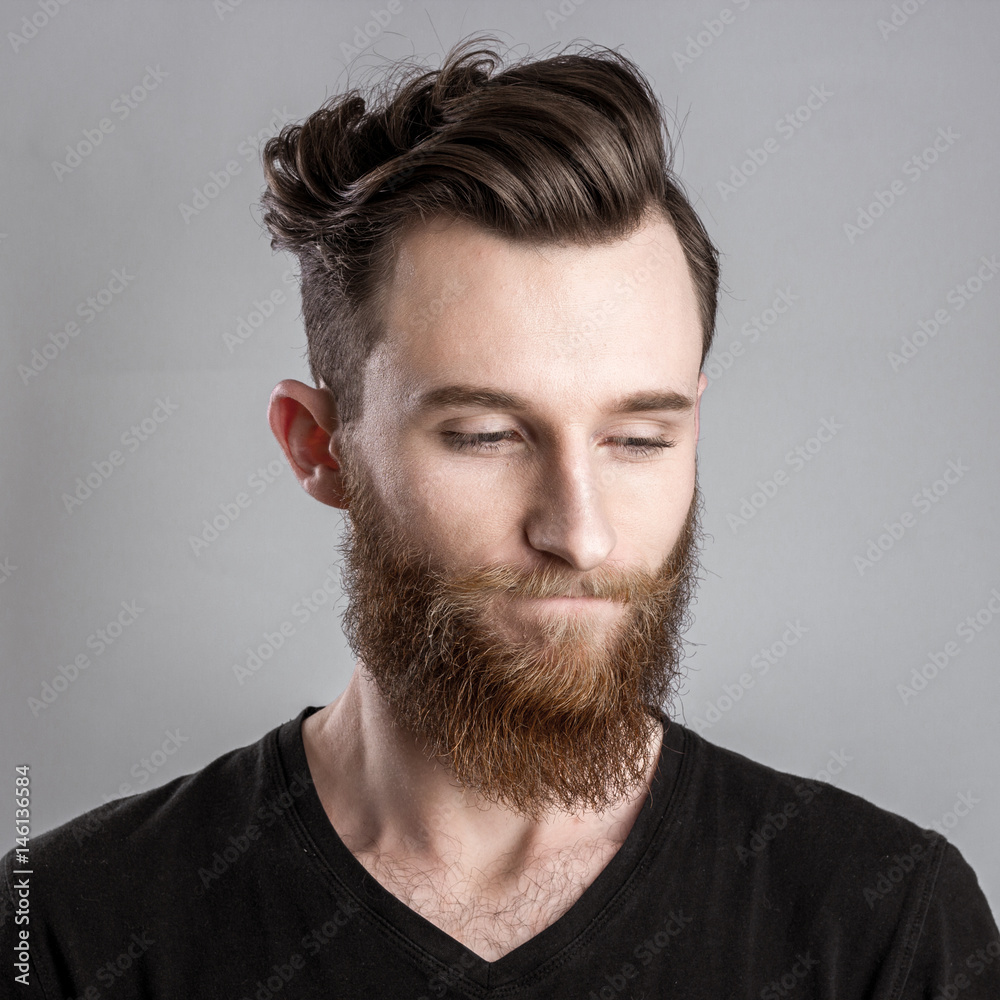 Obraz premium Sad and unhappy young man isolated on gray backround