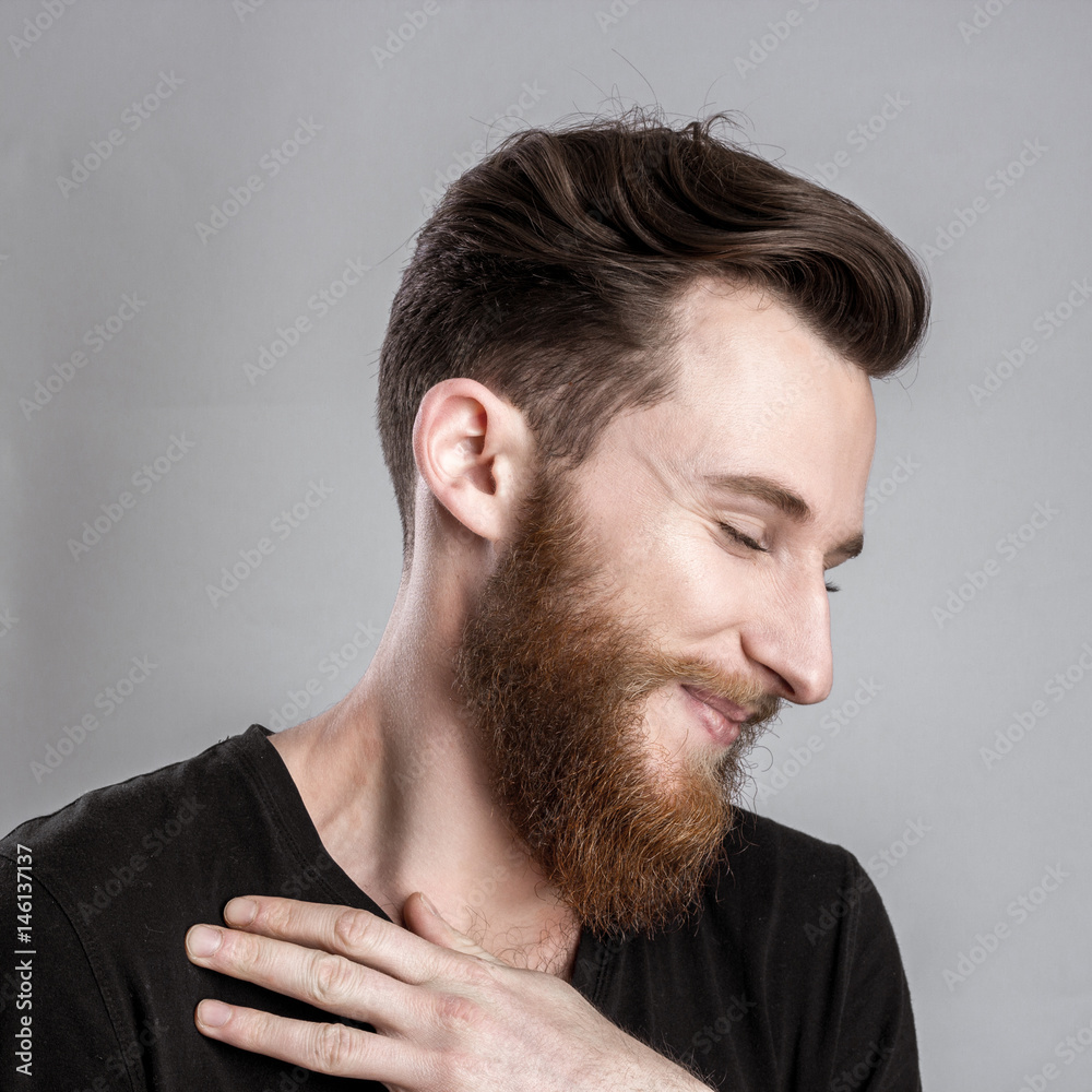 Obraz premium Shy young man isolated on gray backround