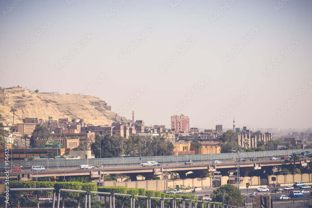 view of mountain with cars on road at cairo, egypt
