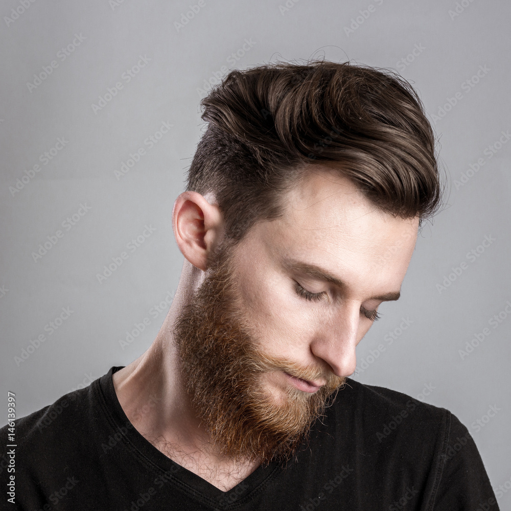 Obraz premium Tired sleepy young man isolated on gray background