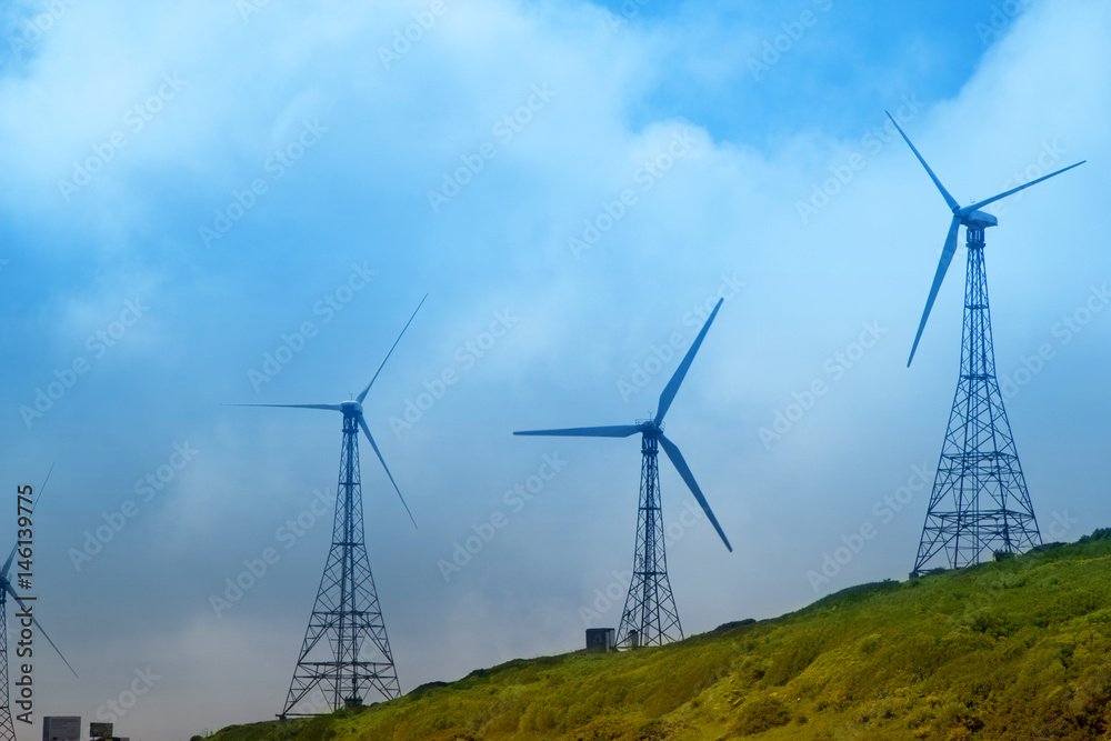 Wind turbines on the green hills of Andalusia