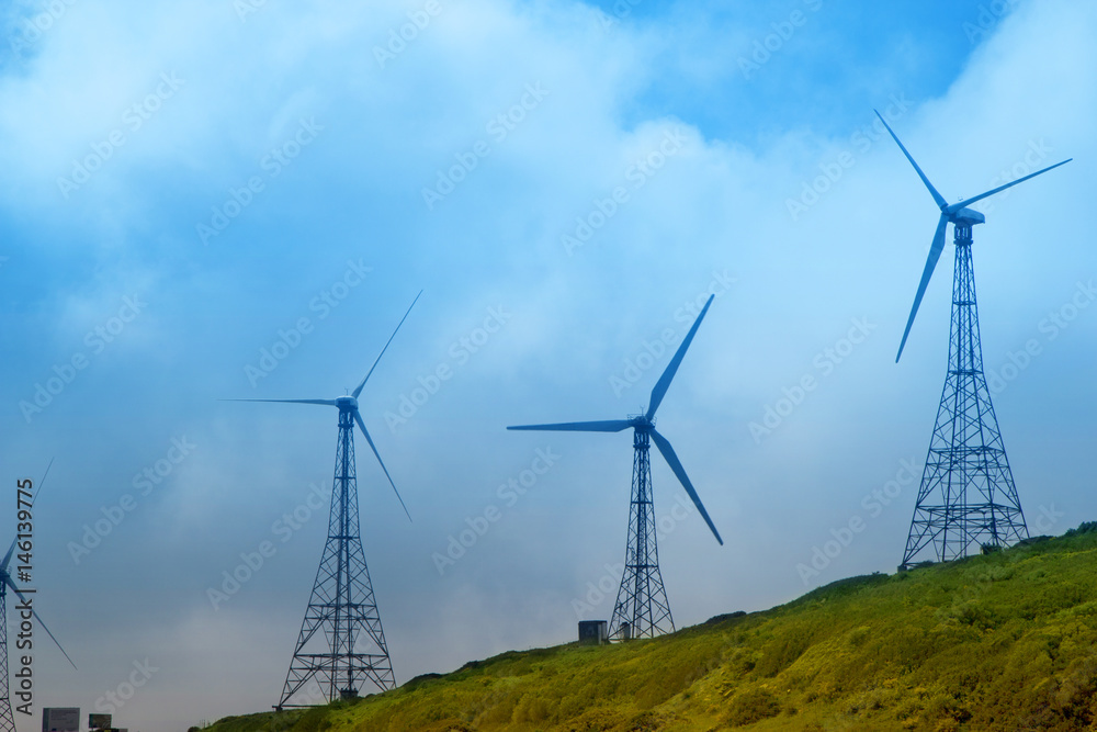 Wind turbines on the green hills of Andalusia Wind turbines on the green hills of Andalusia