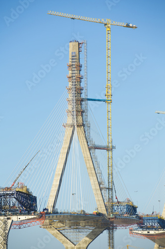 Construction of big guyed bridge in Cádiz over the sea © juananbarros