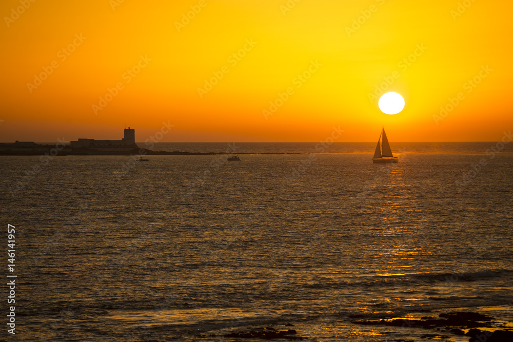 Sail boat in sunset