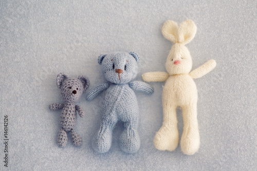 Three soft toy bears and a white hare photo