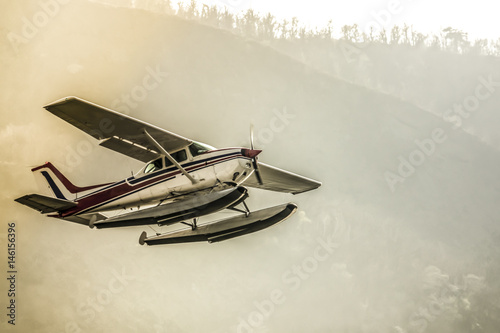 Old seaplane in flight photo